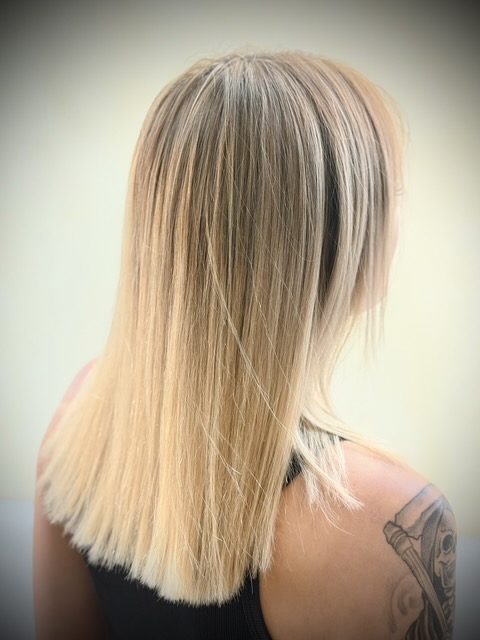 Long light blonde layered hair by Sonias